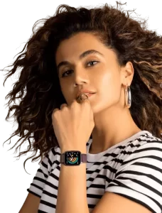 curly hair girl wearing smartwatch and smiling